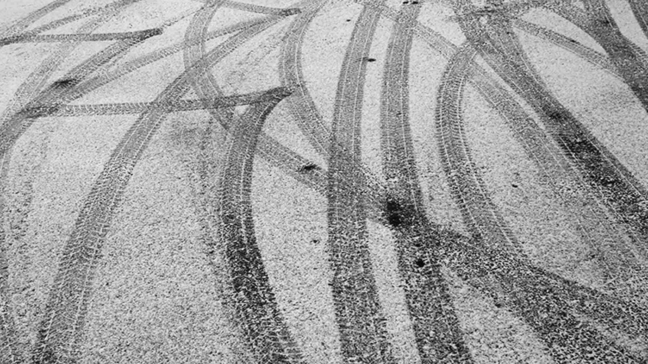 Tire tracks on road in snow