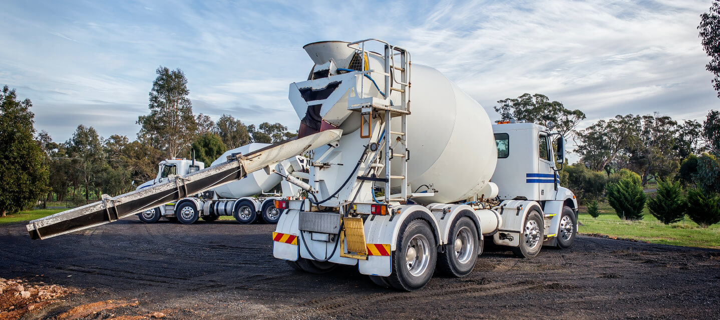 a white cement mixer outside