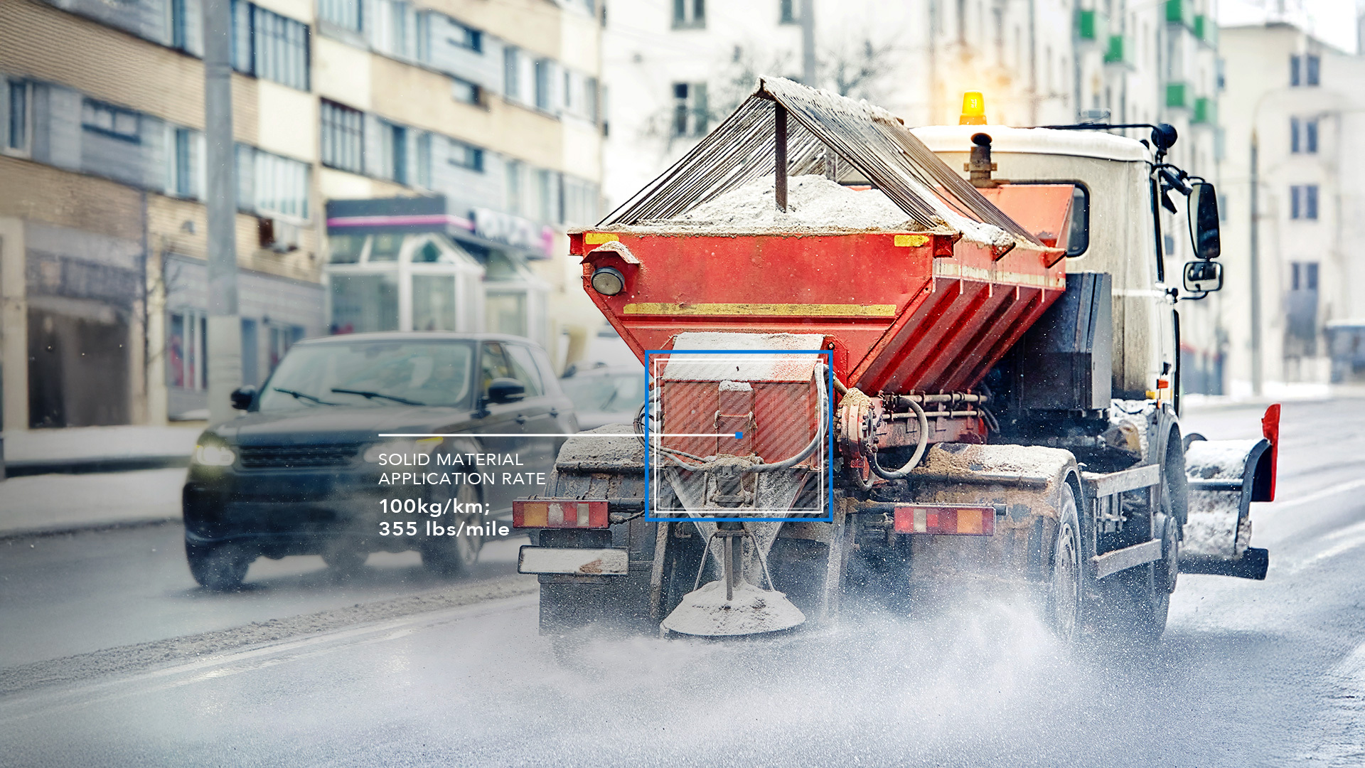 truck putting salt on road