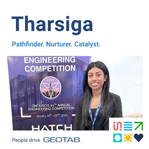 Tharsiga standing in front of a banner