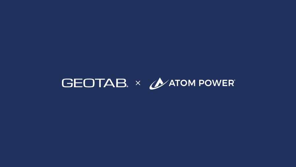 Dark navy blue background with Geotab and Atom Power's logo
