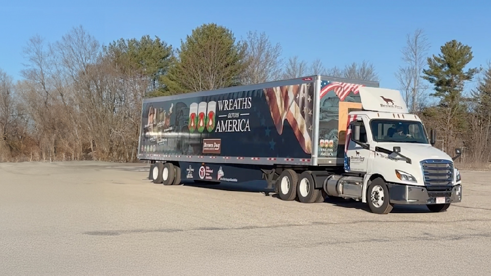 brown dog truck parked sideways