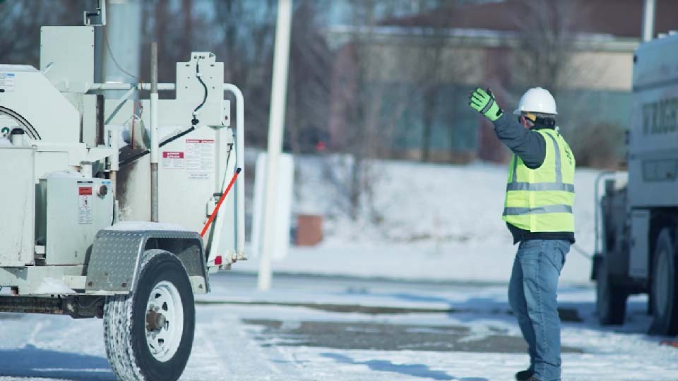 Person doing work outside on a snowy day
