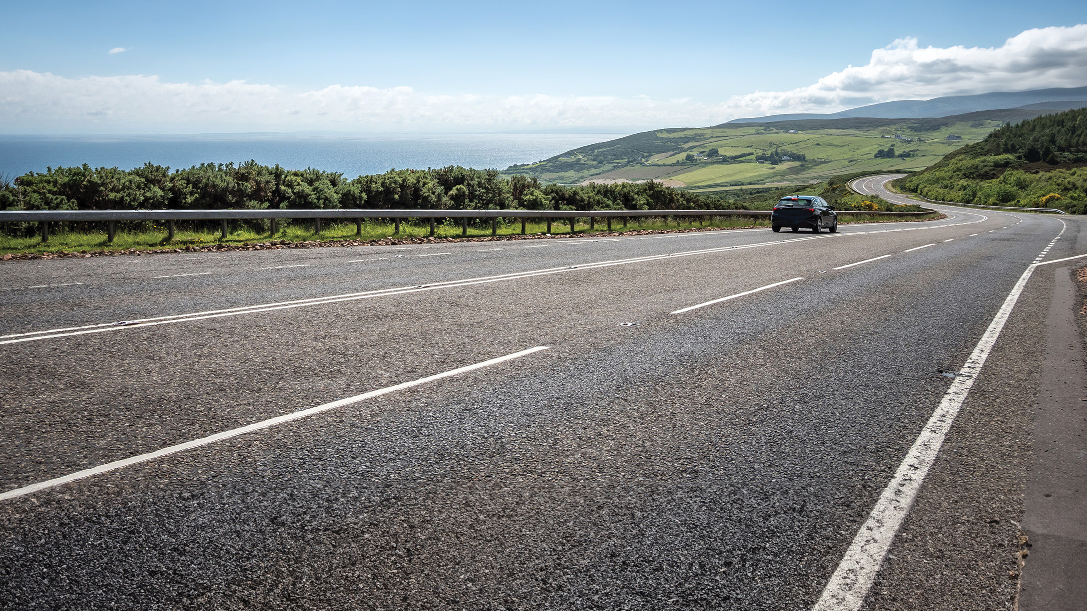 EV Vehicle on the road summer day
