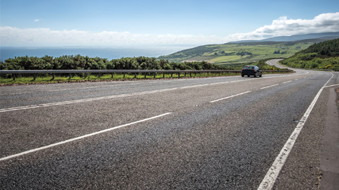 EV Vehicle on the road summer day
