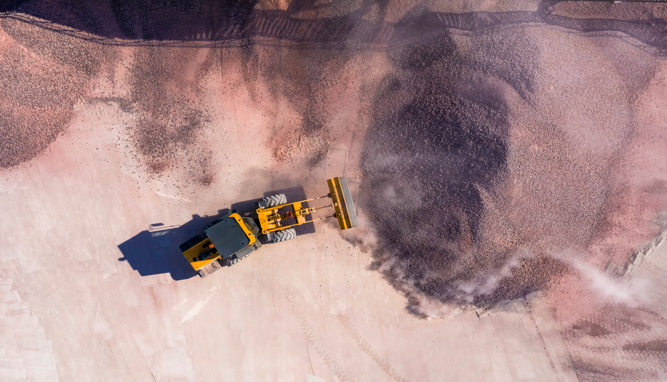 Aerial view of bulldozer moving gravel.